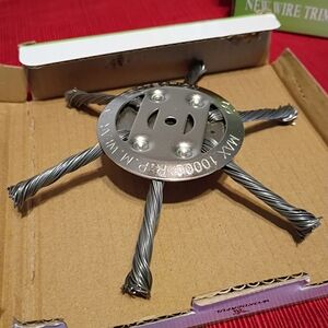 Universal steel wire trimmer head designed as a replacement for string trimmers.